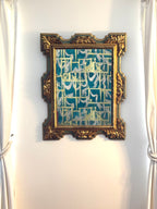 Miroir ancien, cadre doré et vert à motifs de feuillages