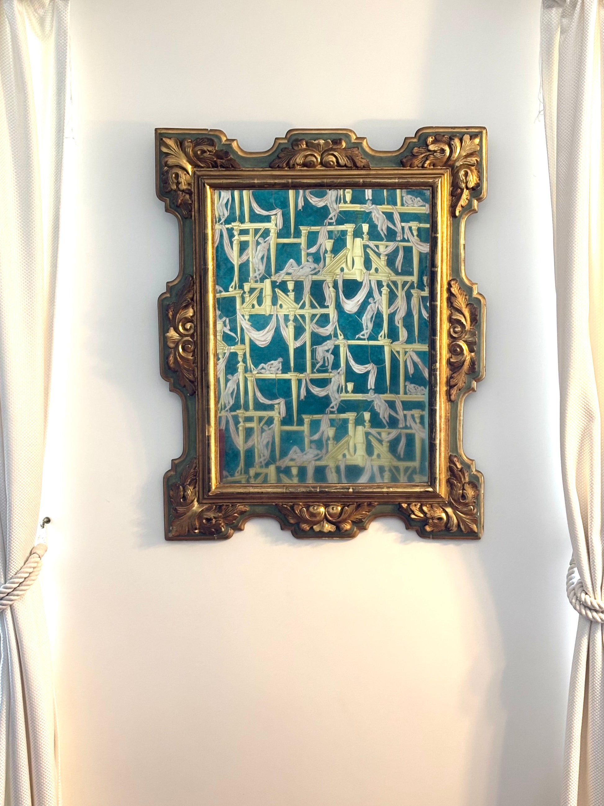 Miroir ancien, cadre doré et vert à motifs de feuillages